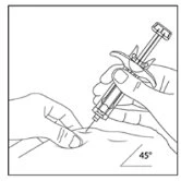 A hand holding a syringe with needle angled at 45 degrees while the