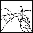 Two hands holding a cylindrical medical device, rotating it clockwise as indicated by a black curved arrow