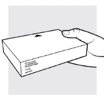 A hand holding a white rectangular box with a black arrow on top and text on the left side