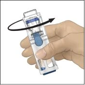 A hand holds a transparent medical device with blue liquid inside