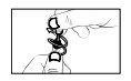 Black and white drawing showing a hand pressing the cap of a medical device onto another circular component