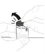 Two hands holding a cylindrical vial while one hand lifts the cap upward