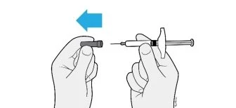 Two hands connecting a needle to a syringe, with a light blue arrow indicating the leftward insertion movement