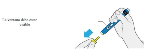 A hand holding a blue and white medical device while the