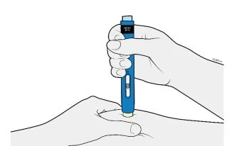 A hand holding a blue injection pen and pressing it against the skin of an arm to administer the drug