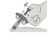 A hand pressing the top button of an auto-injector device to administer medication