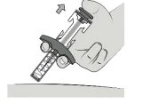 A hand holding a syringe-shaped medical device tilted downward for injection