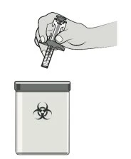 A hand holding a transparent syringe with measurement markings above a biohazard waste container with biohazard symbol
