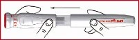 Two hands hold a horizontal injection pen with fingers positioned on the body of the device and a black arrow indicating movement to the left