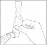 A hand gripping and rotating a cylindrical medical device connected to a flexible tube against a white background