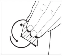 A hand rotating a skin patch according to the direction indicated by a circular curved arrow