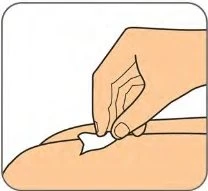 A hand pinching and lifting a skin fold on a part of the body to prepare for injection
