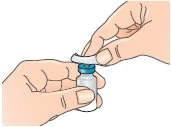 Two hands hold a small glass vial with a blue cap while one hand gently lifts the upper white plastic protective cap