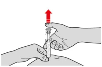 Two hands holding a medical device against an abdomen with a red arrow pointing toward the