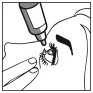 Black and white drawing showing a dropper bottle dispensing a drop into the eye