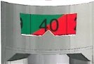 Detail of a medical device with a graduated scale showing the number 40 in black on a green and red background with a central mark