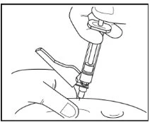 A hand holds a medical device to inject medication into the skin of the body with an arrow indicating injection direction