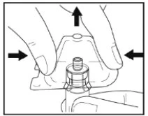 Two hands firmly press the side ends of a transparent medical device toward the center, with black arrows indicating the movement