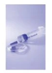 A transparent glass vial with a blue cap and a flat circular container on a monochromatic light blue background