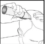 Two hands hold a cylindrical applicator pressed against the top of a person's head for the