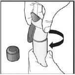 A hand holds a medical device while the