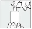 A hand holding the top part of a cylindrical medical device while the