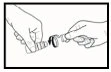 Two hands holding and separating the two components of a cylindrical medical device for drug preparation