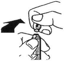 A hand holds a cylindrical medical device while the
