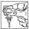 A hand holding an inverted glass vial from which a single drop of medicinal liquid falls