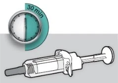 Analog clock indicating a 30-minute interval next to a white medical syringe on a gray and white background