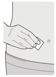 A hand applies a small rectangular adhesive patch to the skin of the forearm