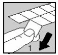 A hand presses the thumb downward on a white tab to peel back or open a section of a medical blister pack with a black arrow