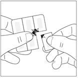 Two hands gently separate a pre-cut medical adhesive patch into two distinct parts on a white background