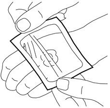 Two hands holding and opening a square medication package to extract the contents through a