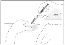 One hand holding a syringe angled at 45 degrees while the