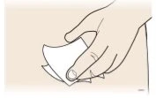 Disegno a tratto di una mano che afferra e solleva l'angolo di un foglio di carta bianco o di un involucro di un medicinale