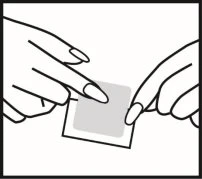 Two hands apply a square gray adhesive bandage onto a white surface using the fingers of the left and right hands