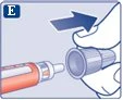 A hand inserting a medical device to the right into a syringe containing orange liquid