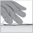 A hand presses with fingers on the skin surface to prepare the area