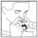 Line drawing of a person holding a small bottle with one hand and bringing the nose close to it