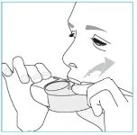 Line drawing of a person holding a device with both hands and bringing it to the mouth to take medication