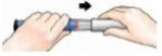 Two hands holding a cylindrical medical device and rotating it to the right following the direction indicated by a black arrow above