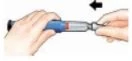 Two hands gripping an injection pen to attach the