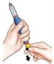 A hand holding a blue and gray injection pen while the