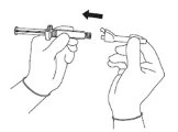 Two hands inserting a protective cap onto the tip of a syringe following the direction indicated by a black arrow