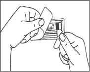 Two hands gently peeling off the protective cover of a rectangular medical device with a horizontal separation line