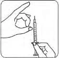 A hand holding a syringe with milliliter graduations while the