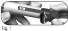 Hands holding a cylindrical medical device with a black arrow pointing towards the