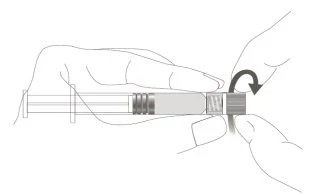 Two hands holding a syringe horizontally while a black curved arrow indicates clockwise rotation of the end part
