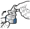 A hand rotating the top part of a blue and white medical device following the direction indicated by a curved arrow
